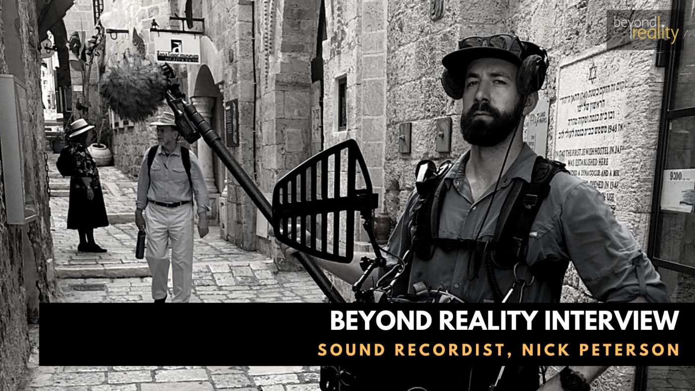 Sound recordist holding boom microphone