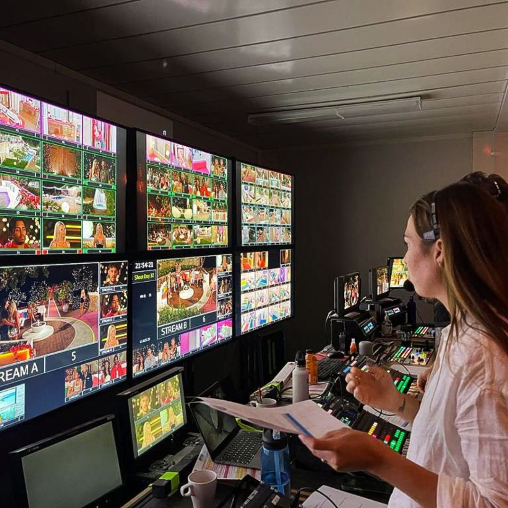 Hayley MacFarlane directing in the control room on a popular reality TV show.